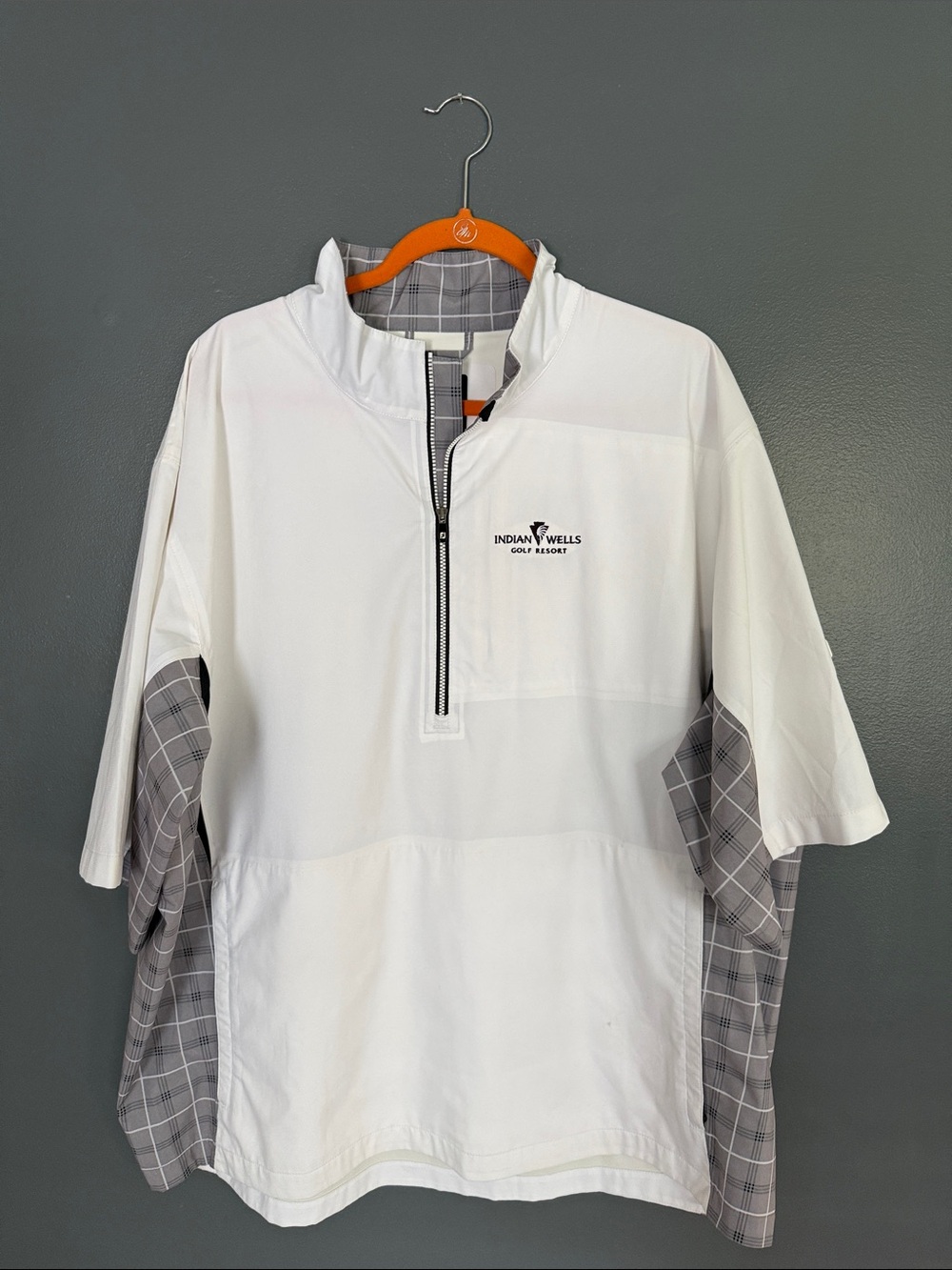 Windbreaker, short sleeve golf shirt.